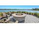 Cozy fire pit area with Adirondack chairs, perfect for enjoying the waterfront view at 8107 Slipway Dr, Sarasota, FL 34240