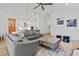 Spacious living room and modern kitchen with large sectional sofa and bar seating at 8107 Slipway Dr, Sarasota, FL 34240