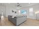 Spacious living room with an oversized sectional, beach-themed art, and modern furnishings at 8107 Slipway Dr, Sarasota, FL 34240