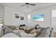 Open-concept living room with a large sectional, stylish coffee table, and bright natural light at 8107 Slipway Dr, Sarasota, FL 34240