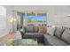 Living room showcasing sliding glass doors that lead to outdoor space and serene lake views at 8107 Slipway Dr, Sarasota, FL 34240