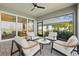 Relaxing outdoor lounge area with stylish furniture and a view of the community and lake at 8107 Slipway Dr, Sarasota, FL 34240