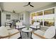 Spacious outdoor patio featuring cozy seating, an outdoor kitchen area, and serene waterfront views at 8107 Slipway Dr, Sarasota, FL 34240