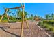 Well-maintained playground with swings, climbing structure, and cushioned ground cover at 8107 Slipway Dr, Sarasota, FL 34240