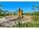 Attractive playground with wooden play structure and modern swings and climbing equipment at 8107 Slipway Dr, Sarasota, FL 34240