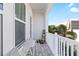 Outdoor balcony features a seating area and views of palm trees and buildings at 845 Burlington N Ave, St Petersburg, FL 33701