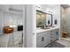 Bathroom featuring double vanity, shower with tile surround and a connecting bedroom at 845 Burlington N Ave, St Petersburg, FL 33701