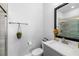 Modern bathroom with a glass-enclosed shower, gray vanity, and stylish decor at 845 Burlington N Ave, St Petersburg, FL 33701