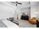 Bedroom featuring a ceiling fan, nice decor, television and a cozy seating area at 845 Burlington N Ave, St Petersburg, FL 33701