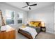 Comfortable bedroom showcasing neutral decor, lots of natural light, and a ceiling fan at 845 Burlington N Ave, St Petersburg, FL 33701