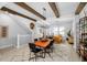 Open-concept dining room featuring exposed beams and a spacious layout with modern decor at 845 Burlington N Ave, St Petersburg, FL 33701