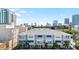 Townhome exterior features blue awnings over windows, small white balconies, and landscaping at 845 Burlington N Ave, St Petersburg, FL 33701