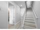 Bright entryway featuring modern finishes, beautiful hardwood floors, and a staircase with white railings at 845 Burlington N Ave, St Petersburg, FL 33701