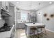 Charming kitchen featuring sleek gray cabinetry, stainless appliances, and a functional island at 845 Burlington N Ave, St Petersburg, FL 33701