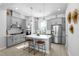Bright, modern kitchen with stainless steel appliances and island with seating at 845 Burlington N Ave, St Petersburg, FL 33701