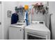 Laundry room featuring a side-by-side washer and dryer and wire shelving at 845 Burlington N Ave, St Petersburg, FL 33701