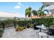 Private patio with lush greenery, pavers, and a charming outdoor seating area at 845 Burlington N Ave, St Petersburg, FL 33701