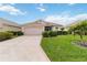 Beautiful one-story home features a lush front lawn and a neutral color palette at 10008 Sugar Mill Dr, Bradenton, FL 34212