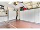 Garage featuring storage cabinets, laundry area, and ample room for parking vehicles at 10008 Sugar Mill Dr, Bradenton, FL 34212