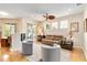 Cozy living room with hardwood floors, neutral furniture, and a ceiling fan at 10008 Sugar Mill Dr, Bradenton, FL 34212