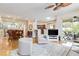 Open-concept living room with a view of the dining area and outdoor patio at 10008 Sugar Mill Dr, Bradenton, FL 34212