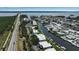 Expansive aerial view of canal-front homes with boat docks, road and waterway access to the bay and the Gulf at 10415 Waterbird Way # 10415, Bradenton, FL 34209