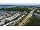 Beautiful aerial view of canal-front homes, lush landscaping, and waterway access to the bay and the Gulf at 10415 Waterbird Way # 10415, Bradenton, FL 34209