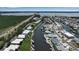 Stunning aerial view of waterfront homes with boat docks along a canal, near the open bay and a bridge at 10415 Waterbird Way # 10415, Bradenton, FL 34209