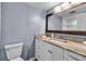 Bathroom features a vanity with marble countertop and modern lighting at 10415 Waterbird Way # 10415, Bradenton, FL 34209