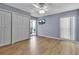 Light-filled bedroom with ceiling fan, new flooring and access to lanai at 10415 Waterbird Way # 10415, Bradenton, FL 34209