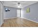 Light-filled bedroom with ceiling fan, tv and new flooring at 10415 Waterbird Way # 10415, Bradenton, FL 34209