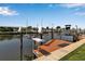 Modern boat dock featuring two boat lifts on the canal at 10415 Waterbird Way # 10415, Bradenton, FL 34209