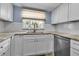 Close up of kitchen showing granite countertops, white cabinets, and stainless appliances at 10415 Waterbird Way # 10415, Bradenton, FL 34209
