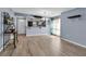 Open-concept living and dining area with wood-look flooring and natural light at 10415 Waterbird Way # 10415, Bradenton, FL 34209