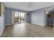 Cozy living room features sliding glass doors to lanai with waterfront views at 10415 Waterbird Way # 10415, Bradenton, FL 34209