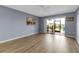 The living room features sliding glass doors to lanai with waterfront views at 10415 Waterbird Way # 10415, Bradenton, FL 34209