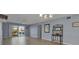 Bright and airy living room with a sliding glass door leading to the outside seating area at 10415 Waterbird Way # 10415, Bradenton, FL 34209
