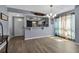 Bright living space featuring modern flooring, an open kitchen, and waterfront view at 10415 Waterbird Way # 10415, Bradenton, FL 34209