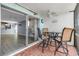 Patio with sliding glass door and bar-height table and chairs at 10415 Waterbird Way # 10415, Bradenton, FL 34209