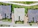 Aerial view of a collection of waterfront homes featuring well-manicured lawns and brick driveways at 1264 Riverscape St # B, Bradenton, FL 34208