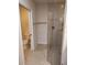 Bathroom showcasing a glass door shower and adjacent toilet area with tile flooring at 1264 Riverscape St # B, Bradenton, FL 34208
