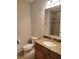 Bathroom featuring vanity, sink, toilet, and shower with tile at 1264 Riverscape St # B, Bradenton, FL 34208