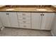 Bathroom vanity with double sinks, granite countertop, and white cabinetry at 1264 Riverscape St # B, Bradenton, FL 34208