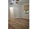 Bedroom with vinyl plank floors, sliding door closet, and window view at 1264 Riverscape St # B, Bradenton, FL 34208