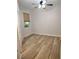 Bedroom featuring vinyl floors, ceiling fan and natural light at 1264 Riverscape St # B, Bradenton, FL 34208