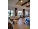 Inviting clubhouse lounge area with comfortable seating, stone accents, and ample natural light from large windows at 1264 Riverscape St # B, Bradenton, FL 34208