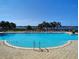 Large community pool with expansive views, comfortable lounge chairs, and tranquil landscaping for a resort-style feel at 1264 Riverscape St # B, Bradenton, FL 34208
