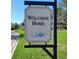 Inviting community sign amidst lush landscaping, welcomes you home at 1264 Riverscape St # B, Bradenton, FL 34208
