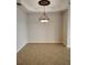 Neutral dining room featuring diamond tiled floors and an elegant decorative light fixture at 1264 Riverscape St # B, Bradenton, FL 34208