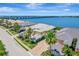 Beautiful home featuring a manicured lawn, a neutral-colored exterior, and a gorgeous waterfront view at 1264 Riverscape St # B, Bradenton, FL 34208